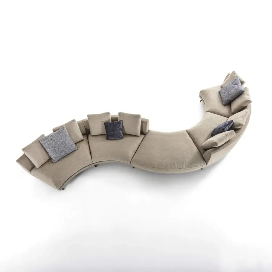 Distinguished Porada Étienne sofa with inviting curved form, neutral beige Microflock upholstery and pewter grey metal base crafted with wooden inserts
