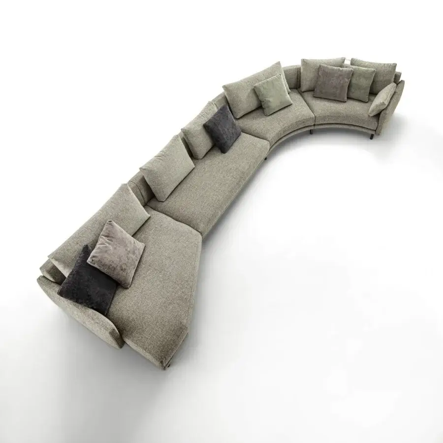 Exceptional Porada Étienne sofa with curved form, muted gray textile upholstery and pewter grey metal feet with wooden inserts