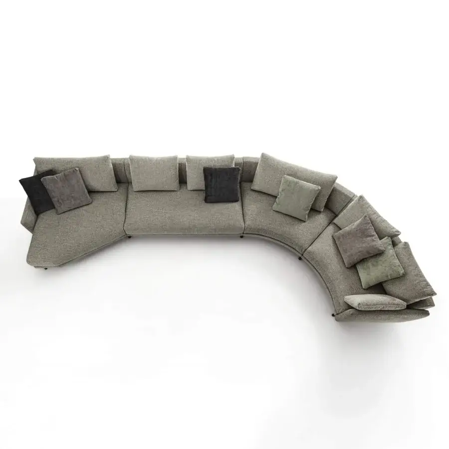 Superior Porada Étienne sofa with gently curved sectional form, textured muted gray Microflock upholstery and pewter grey metal feet crafted with wooden inserts