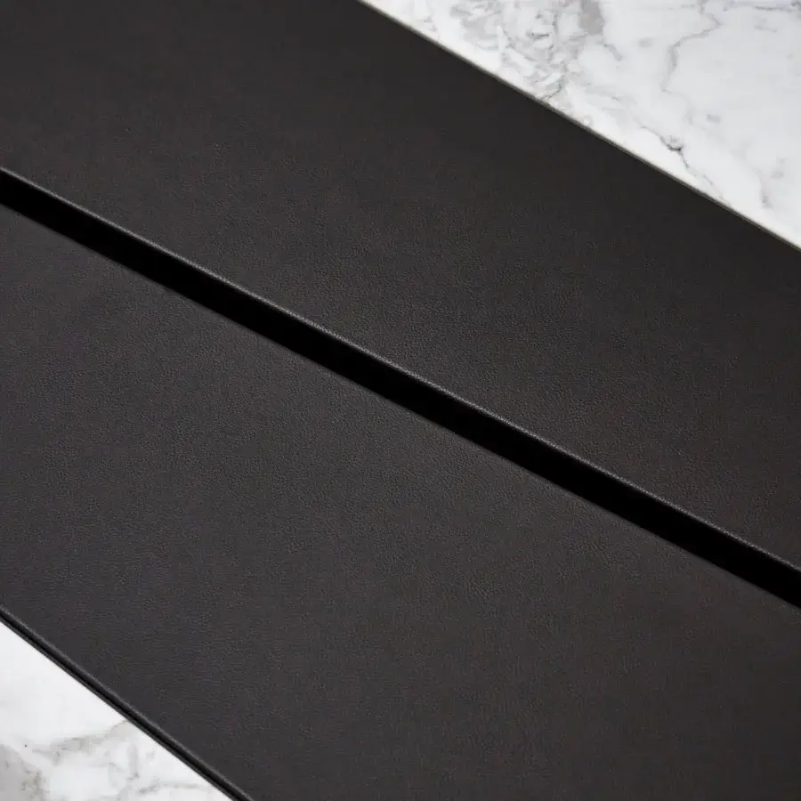 Superior Giorgetti Scaleno coffee table built with ash wood, cool marble, supple leather, and a deep black matte finish
