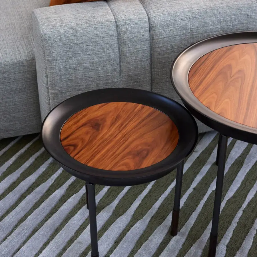 Distinguished Giorgetti Athene side table with sculpted form, polished maple and radiant Pau Ferro, supported by glazed bronzed metal legs