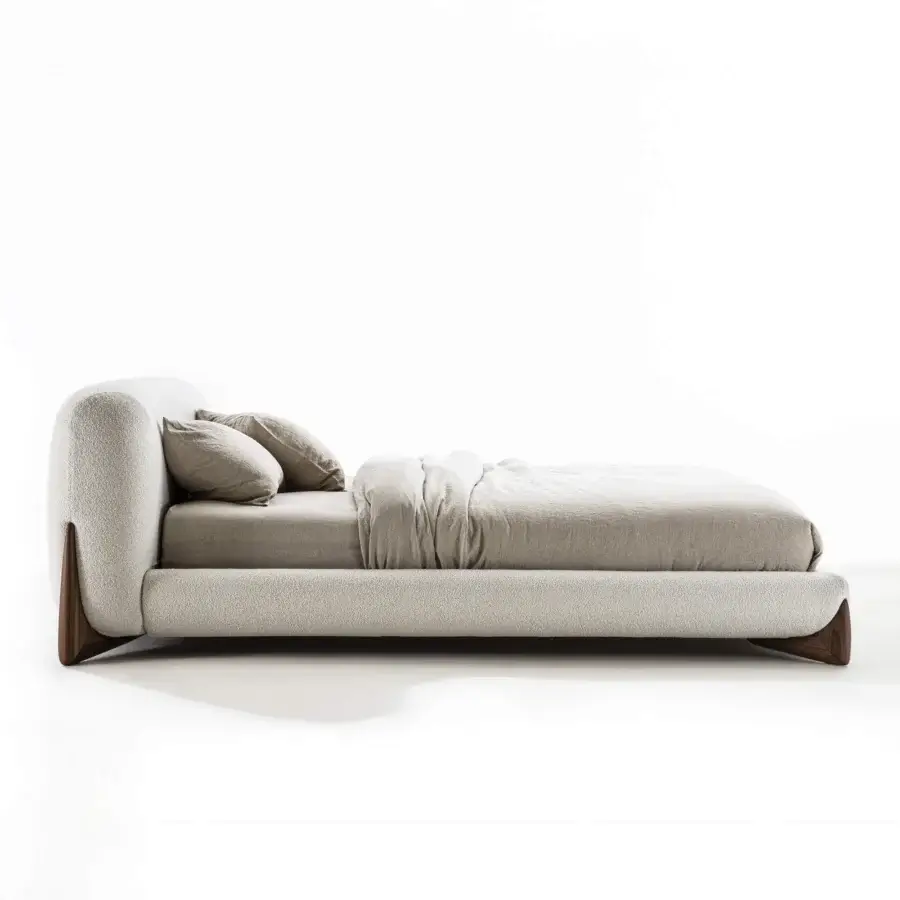Exclusive Porada Softbay bed crafted in neutral beige textile with solid Canaletta walnut wood end-feet and satin finish