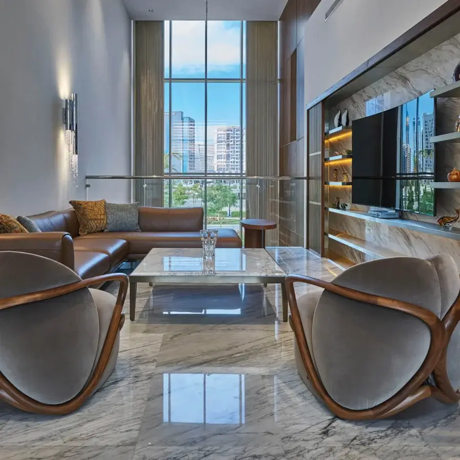 Elegant Giorgetti Ago coffee table with a sleek glass top and gracefully curved Canaletto walnut base