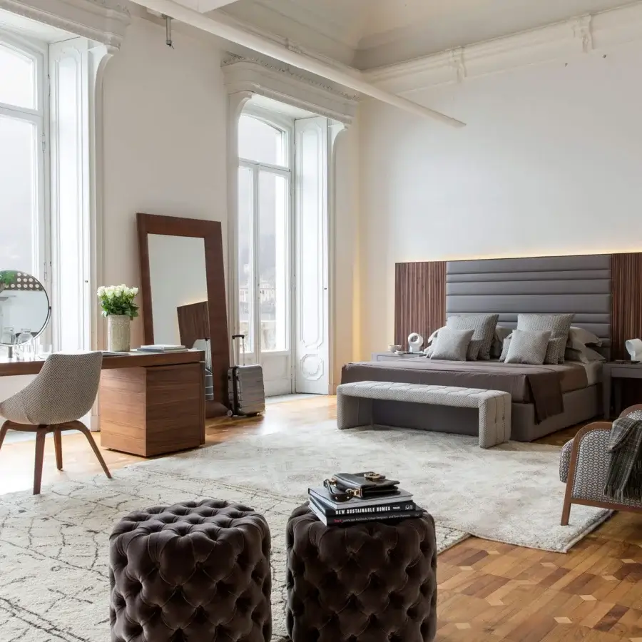 Exceptional Porada Boheme & Morfeo bed crafted with canaletto walnut and dark gray textile upholstery exhibiting balanced proportions and meticulous stitching