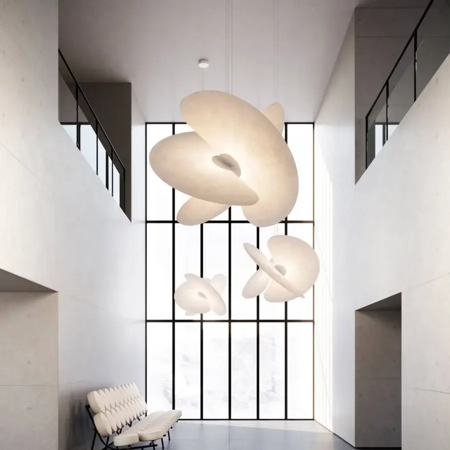 Exceptional Luceplan Levante suspension lamp with pale off-white diffusers and an aluminum core exhibiting undulating layers