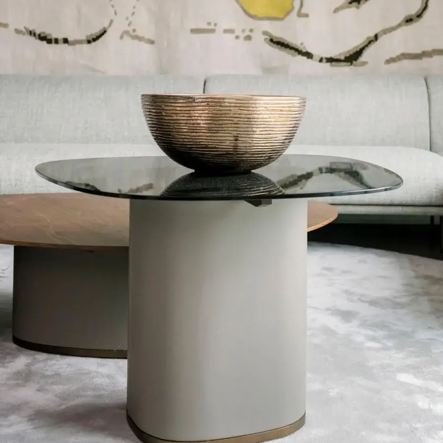 Elegant Giorgetti Galet coffee table with tempered glass top and muted gray leather wrapped base with bronze finish