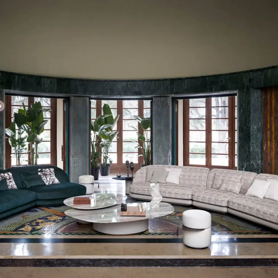 Superior Giorgetti Galet coffee table with creamy white and light gray polished marble top and dark gray textured leather-wrapped base with bronze accents