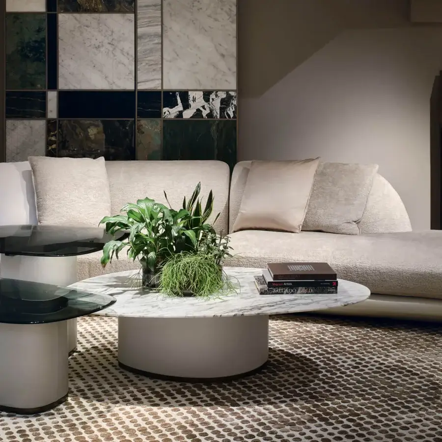 Distinguished Giorgetti Galet coffee table with marble displaying white and gray veining and a satin sheen leather-wrapped cylindrical base