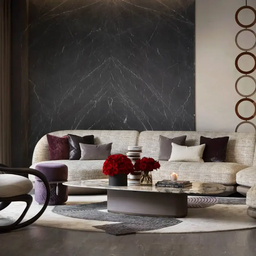 Elegant Giorgetti Galet coffee table with charcoal marble tabletop and leather-wrapped base finished in warm bronze metal