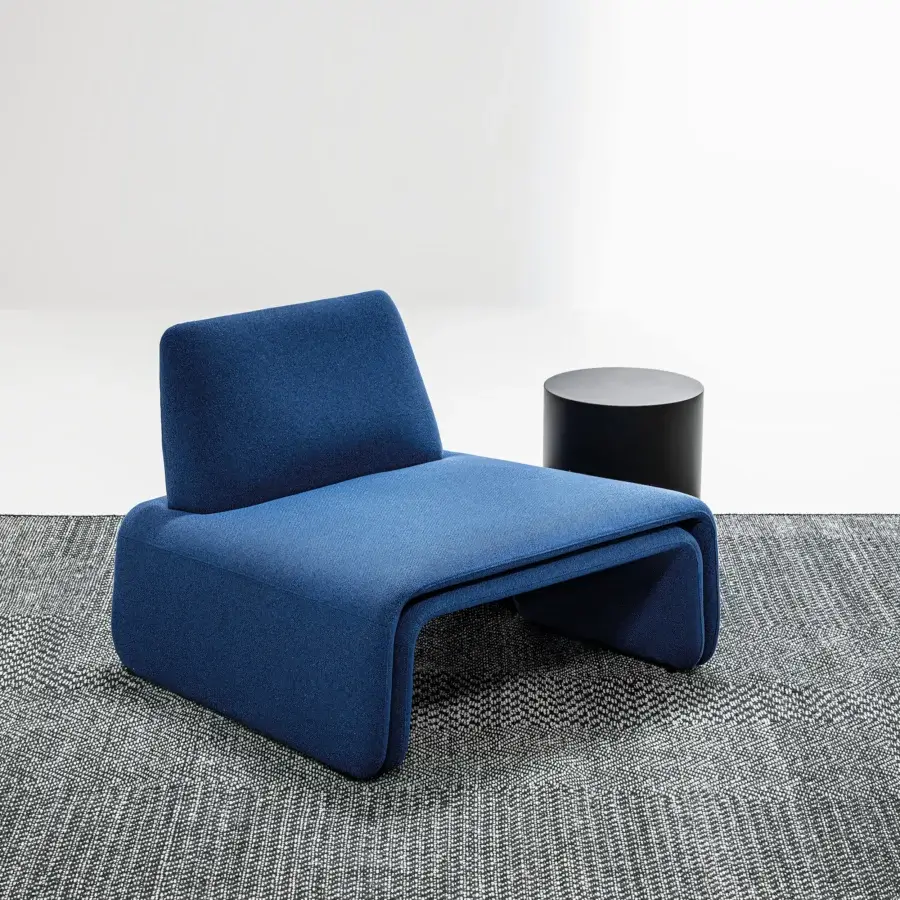 Captivating LaCividina FourFolds lounge chair in saturated blue textile with a matte finish embodies contemporary comfort