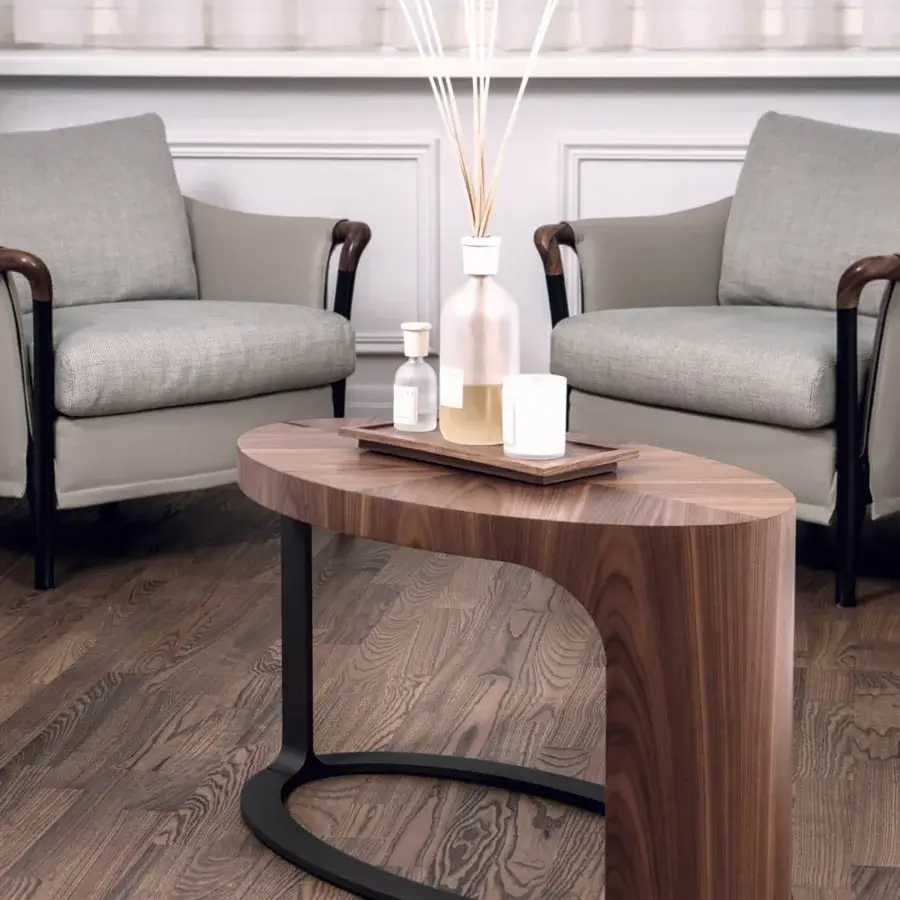 Elegant Giorgetti Ling coffee table with sculpted Canaletto walnut veneer and a satin sheen bronze-painted metal base