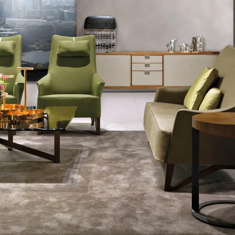 Distinguished Giorgetti Ling coffee table with a sleek glass tabletop and dynamic Canaletto walnut veneer base with golden bronze finish