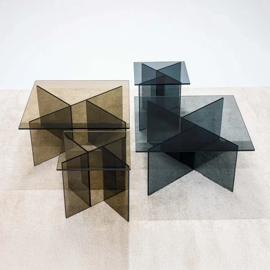 Distinguished LaCividina Niby coffee side table crafted in amber glass with intersecting planes and minimalist form