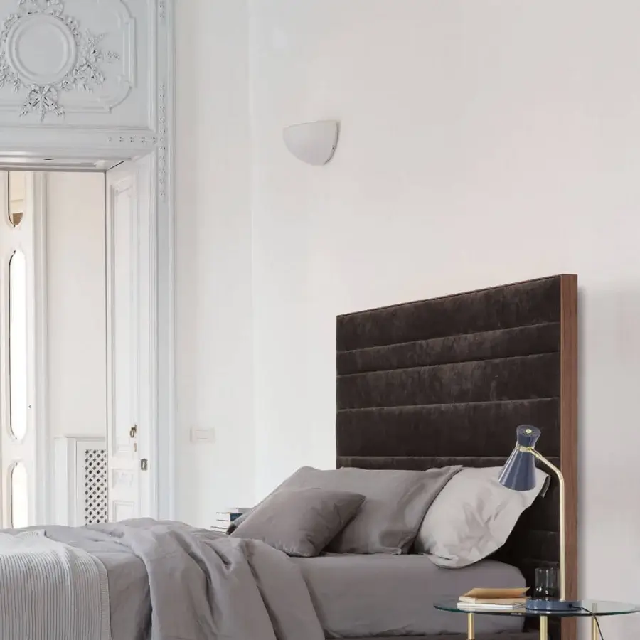 Distinguished Porada Boheme & Morfeo bed with dark brown upholstered textile and solid canaletto walnut frame showcasing horizontal stitching