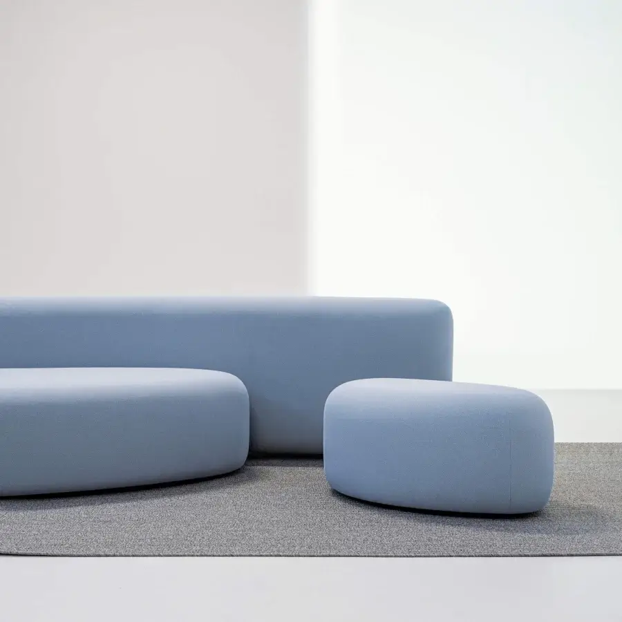 Distinguished LaCividina Lisse sofa with low organic form upholstered in matte finish two-way stretch fabric presenting a light blue hue