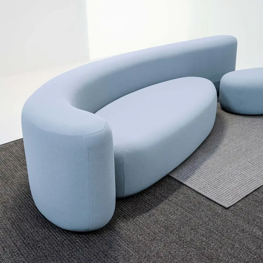 Superior LaCividina Lisse sofa with sinuous contemporary form upholstered in muted light blue two-way stretch fabric