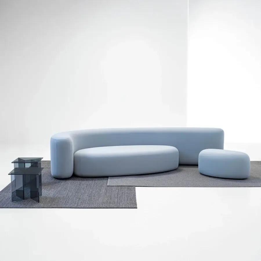 Lavish LaCividina Lisse sofa with strikingly organic curved form upholstered in matte light blue two-way stretch fabric
