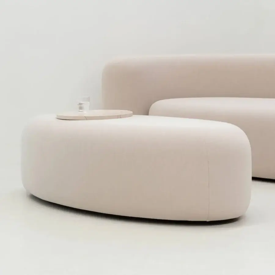 Captivating LaCividina Lisse ottoman with gently curved lines upholstered in pale beige two-way stretch fabric and matte finish