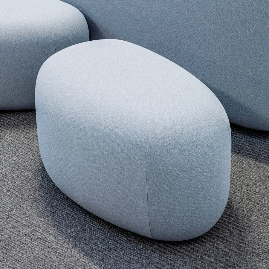 Elegant LaCividina Lisse ottoman with organic form upholstered in smooth two-way stretch fabric presenting a light blue-grey hue