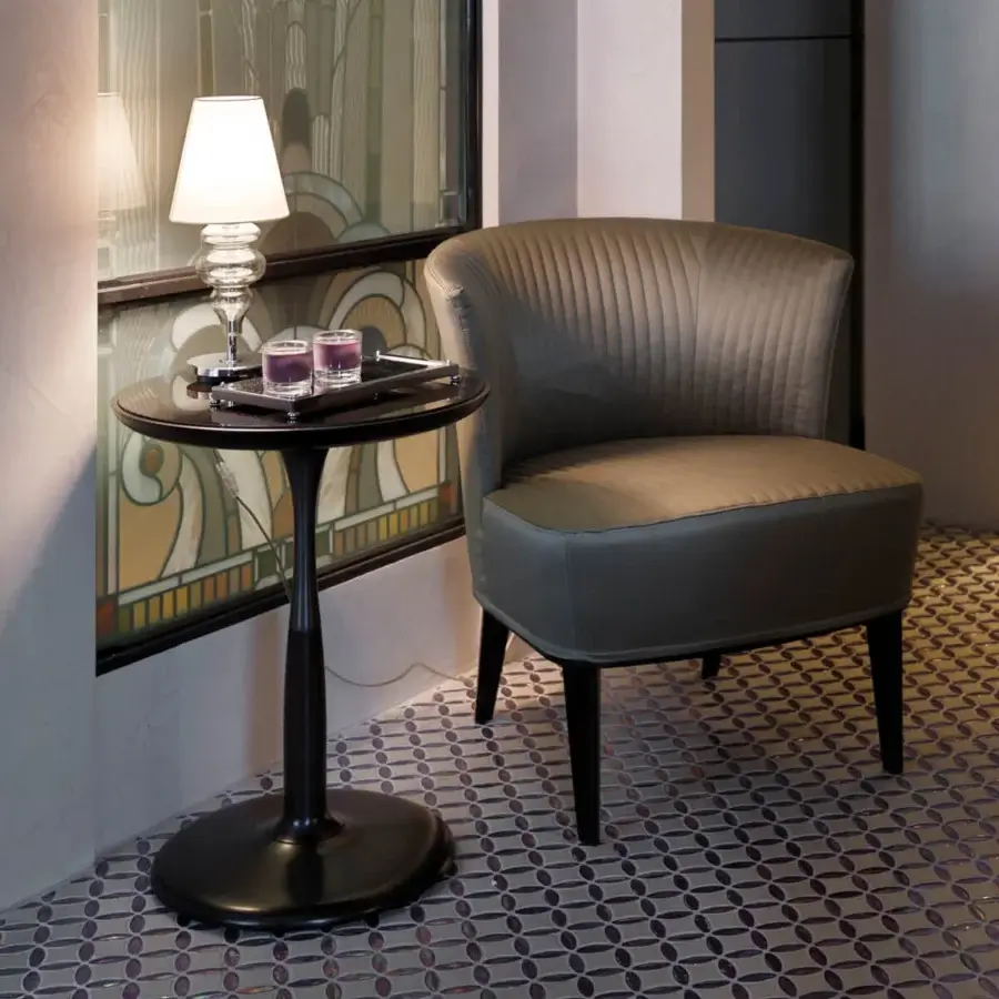 Distinguished Giorgetti Oti side table with polished Pau ferro veneer tabletop and satin-finished bronze column insert and base