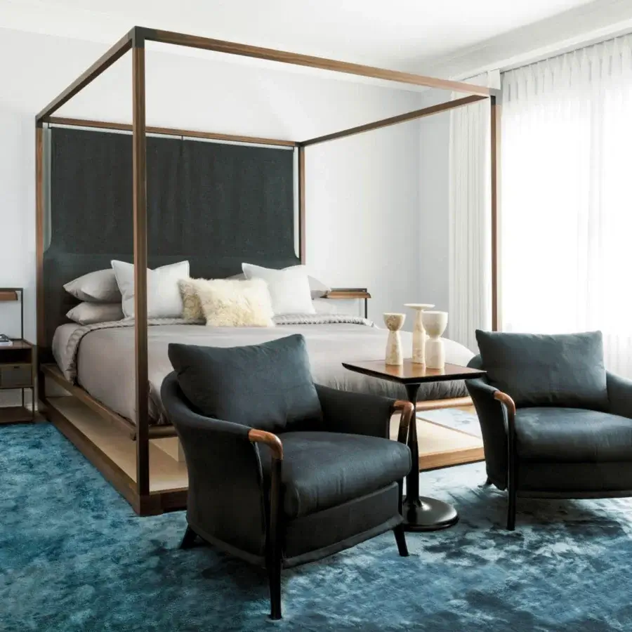 Distinguished Giorgetti Oti side table with polished Pau ferro veneer tabletop and satin-finished bronze column insert