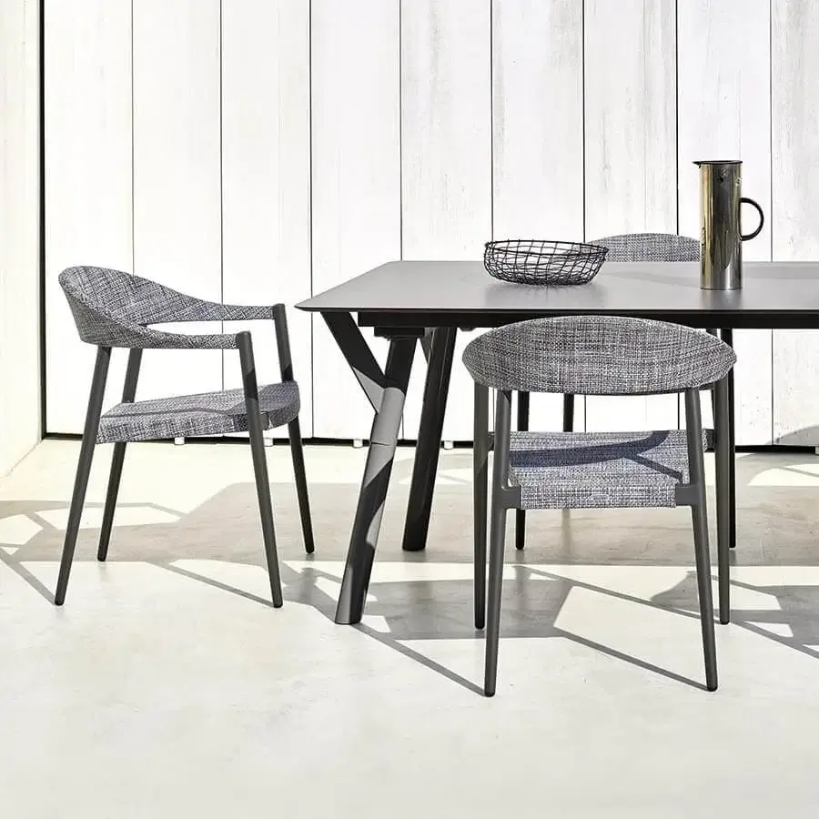 Sophisticated Varaschin Clever armchair with aluminum frame and VAR#TEX fabric upholstery in a subtle gray and white pattern