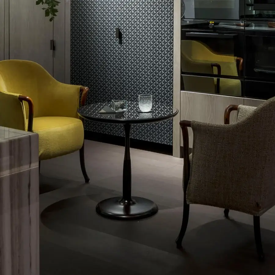 Elegant Giorgetti Oti side table with glacé crystal glass top and satin-finished bronze base and column insert
