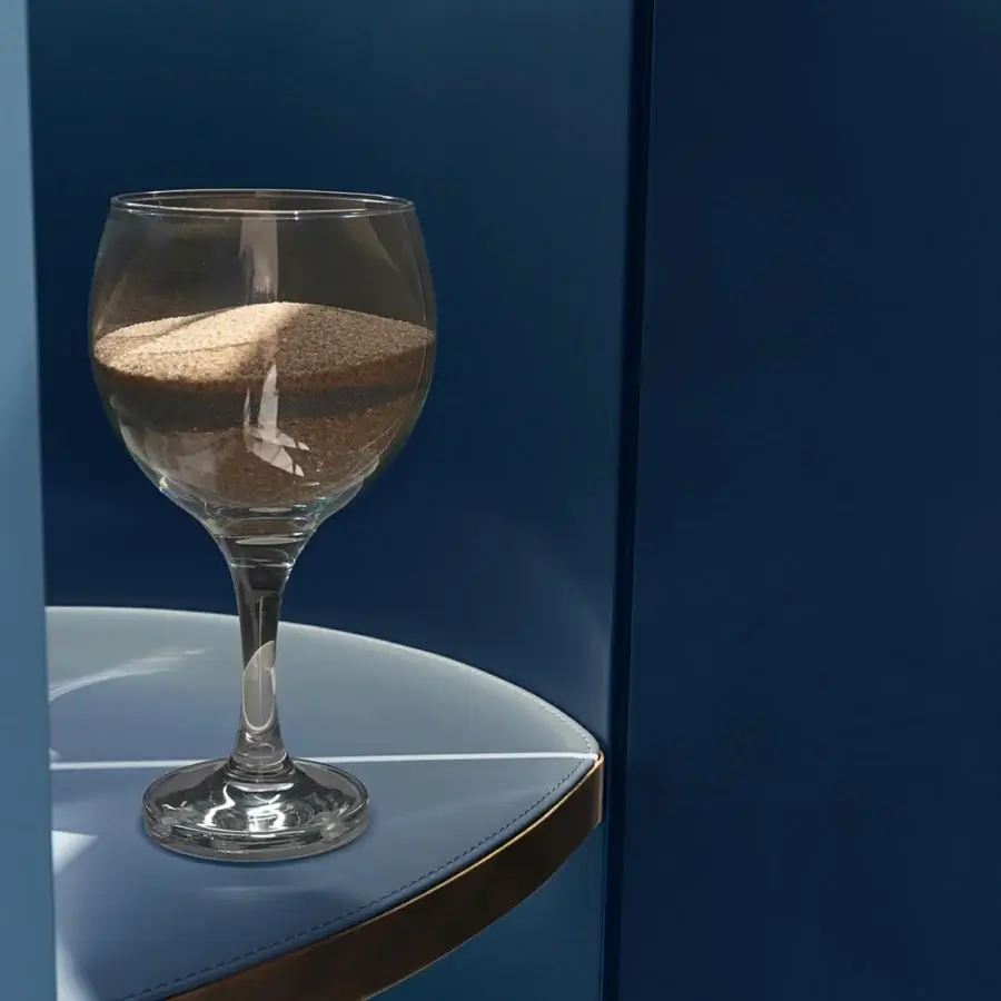 Exceptional Visionnaire Siona bar cabinet with curved form and deep blue finish crafted in mixed media with gold detailing
