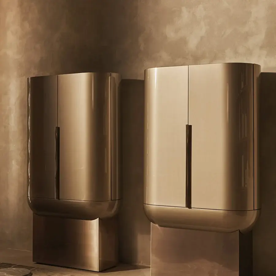 Superior Visionnaire Siona bar cabinet in satin-finished metal with curved silhouette and warm gold tone