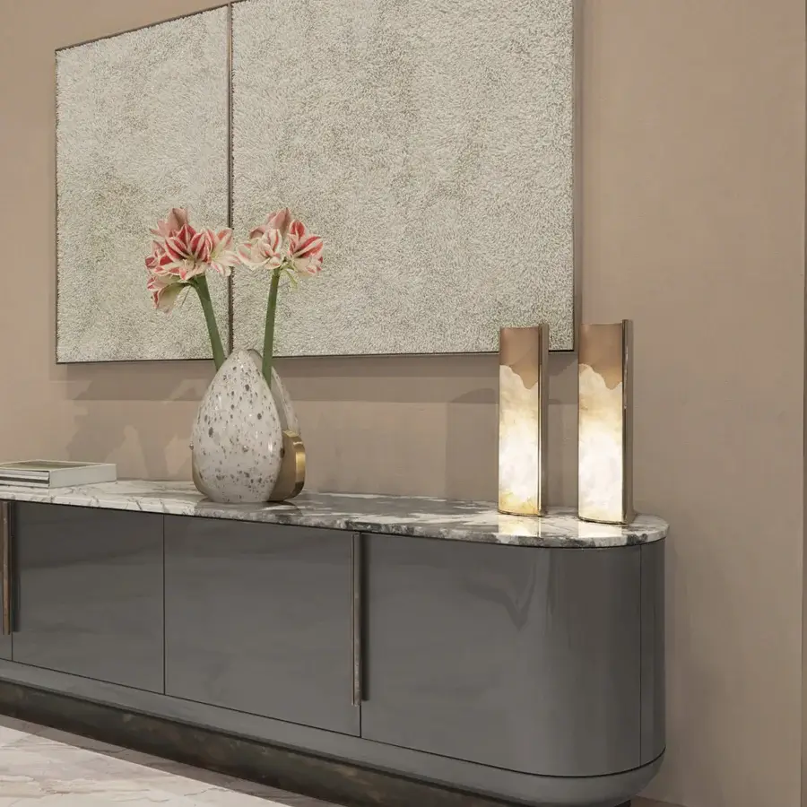 Superior Visionnaire Siona sideboard with curved form, polished marble top, and satin stainless steel plinth built with wood and leather