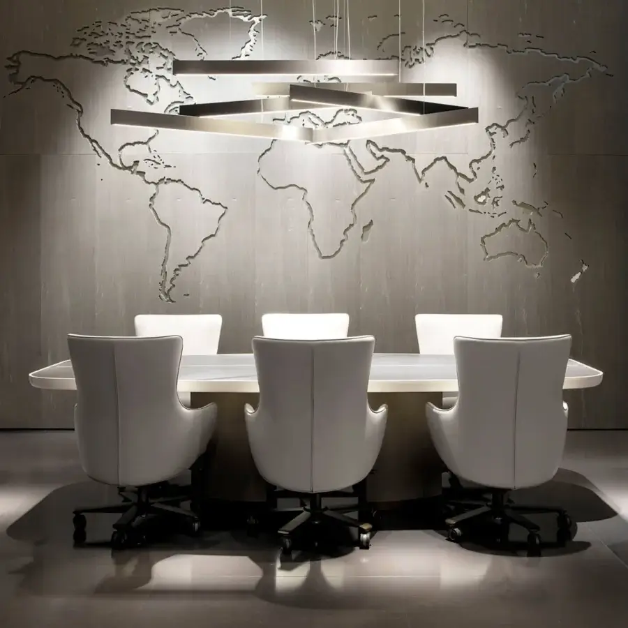 Elegant Giorgetti Genius armchair with profiled steel backrest and neutral fabric upholstery with bronze finish