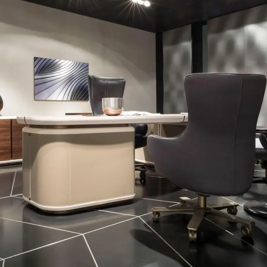 Distinguished Giorgetti Genius armchair with subtly textured medium gray textile upholstery and natural-effect bronze revolving base