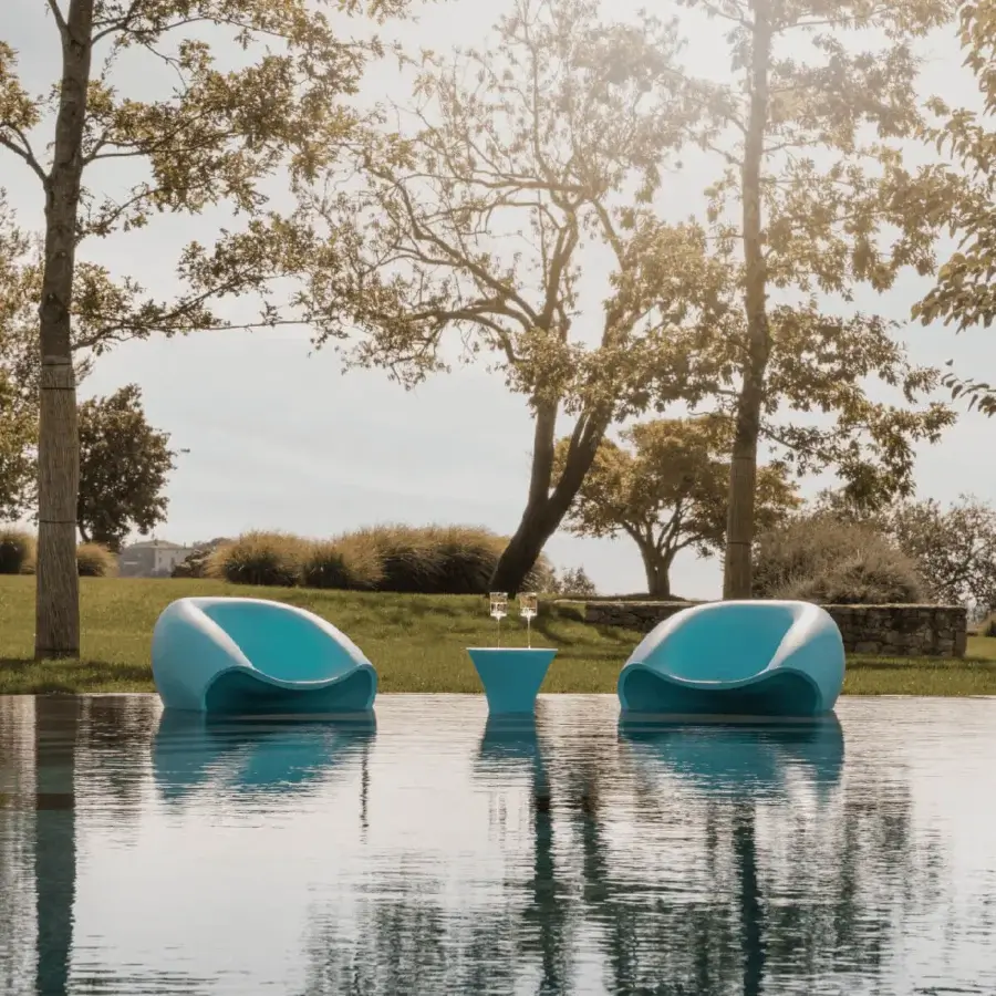 Superior MY YOUR Iris Lounge chair in turquoise recyclable Poleasy with a glossy finish embodies contemporary elegance