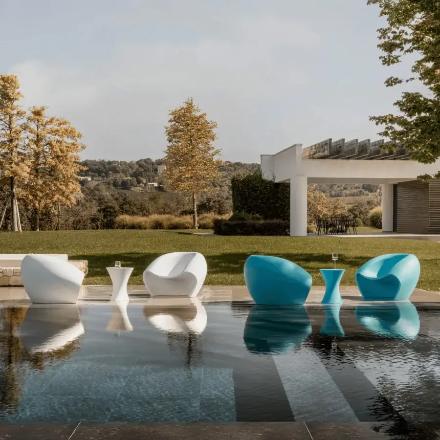 Captivating MY YOUR Iris Lounge chair in turquoise recyclable Poleasy with a glossy finish