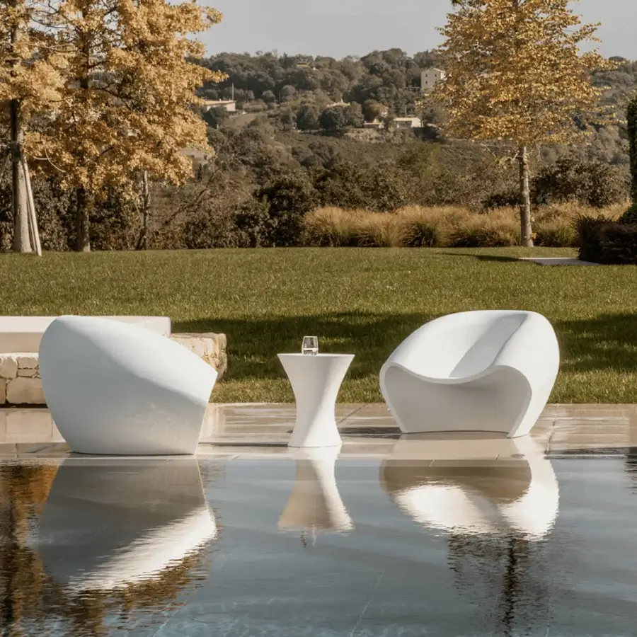 Distinguished MY YOUR Iris Lounge chair crafted in white recyclable Poleasy with continuously flowing lines and glossy finish