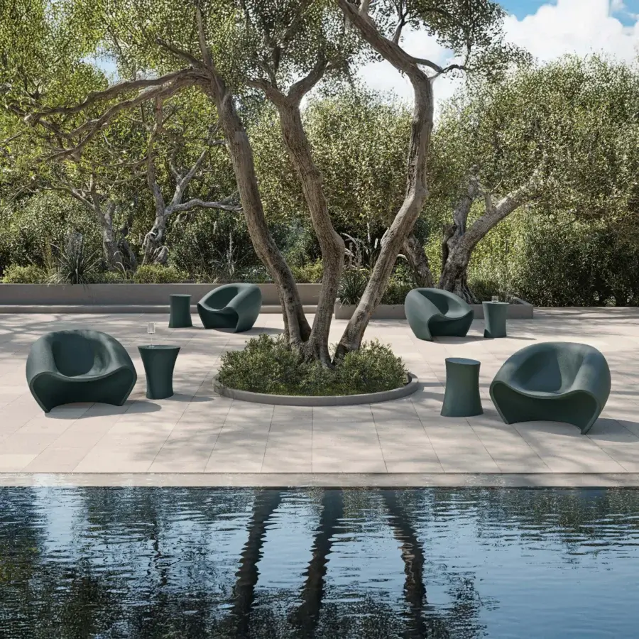 Captivating MY YOUR Iris Lounge chair crafted in deep teal recyclable Poleasy with smooth matte finish