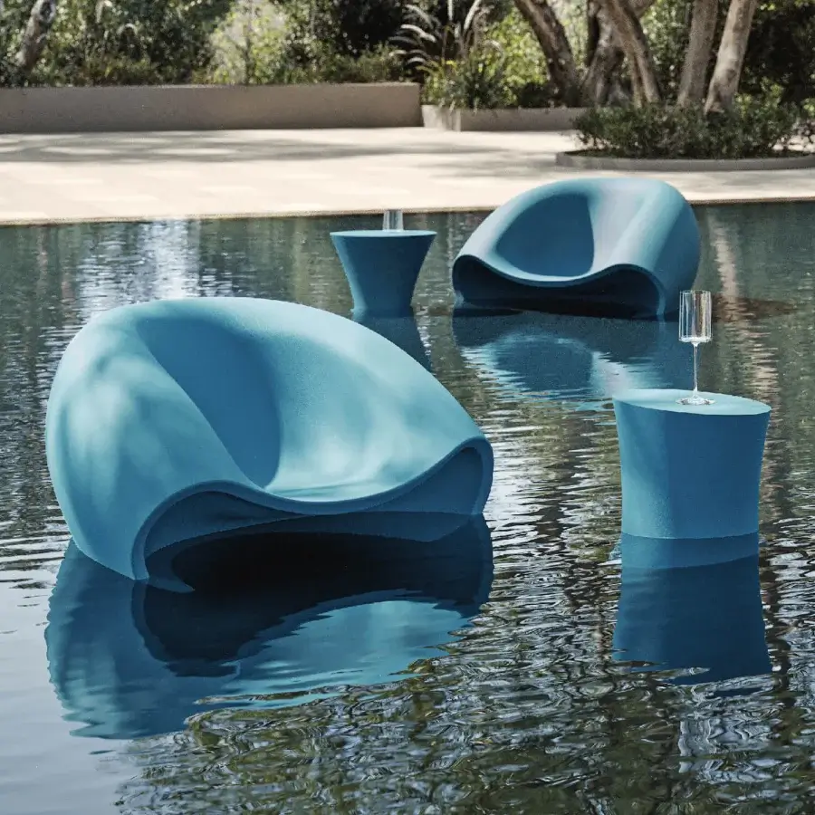Superior MY YOUR Iris coffee table crafted in recyclable Poleasy with glossy muted teal blue curved silhouette