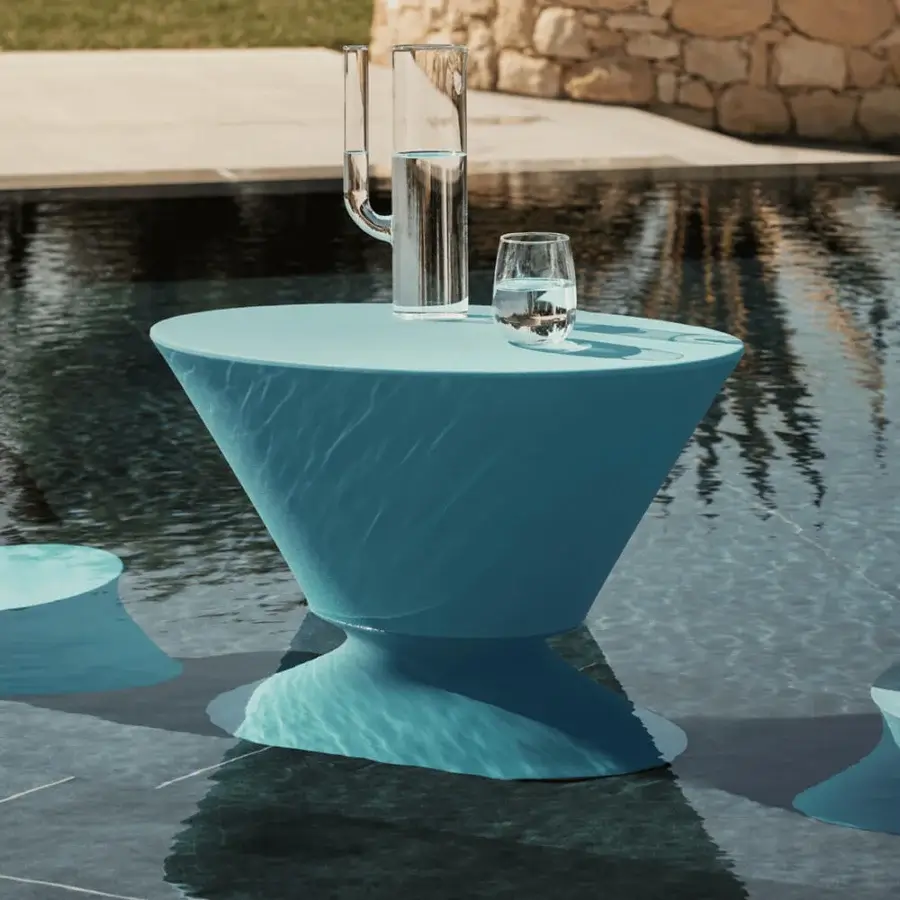 Innovative MY YOUR Iris table crafted from recyclable Poleasy in a muted pastel blue with a subtly textured surface