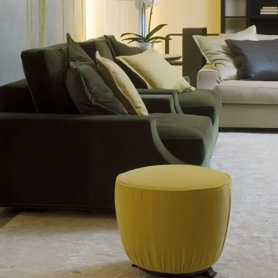 Lavish Giorgetti Topaze ottoman crafted in muted yellow textured fabric with polished beech feet