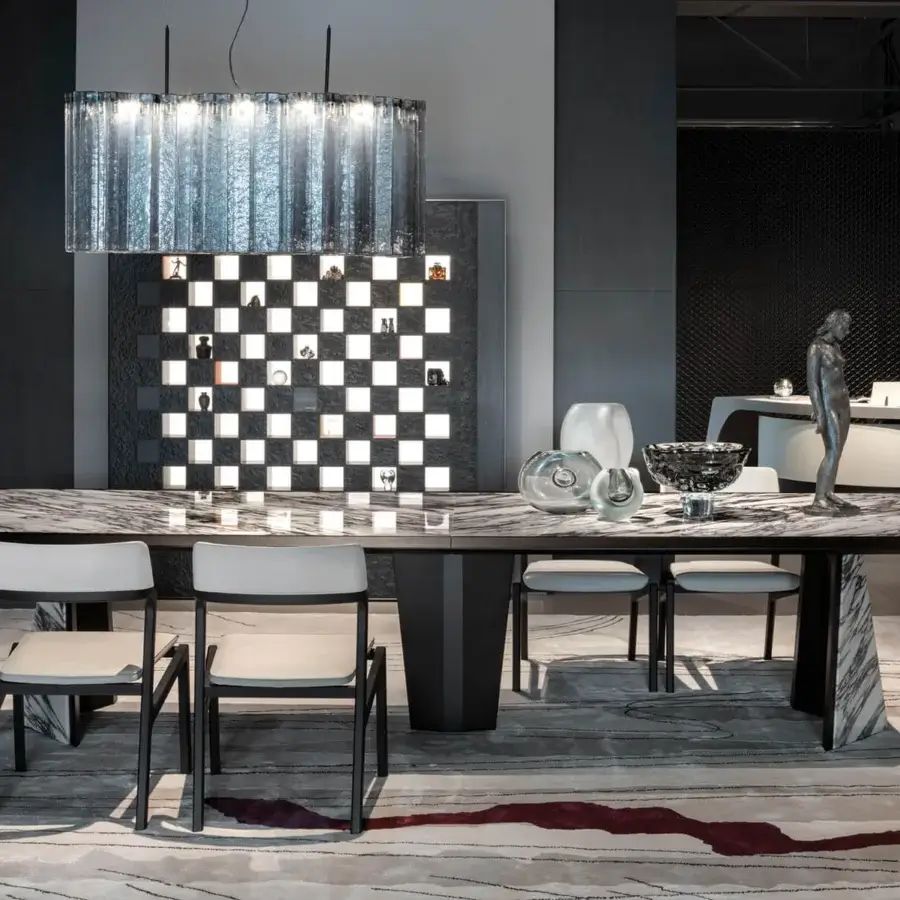 Distinguished Giorgetti Amadeus table crafted in Canaletto walnut with striking marble inserts and a polished finish