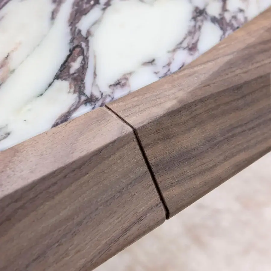 Distinguished Giorgetti Amadeus table crafted with Canaletto walnut and white marble inserts in a satin finish