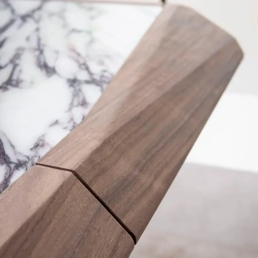 Captivating Giorgetti Amadeus table with a Canaletto walnut top and angled legs built in marble with a satin finish