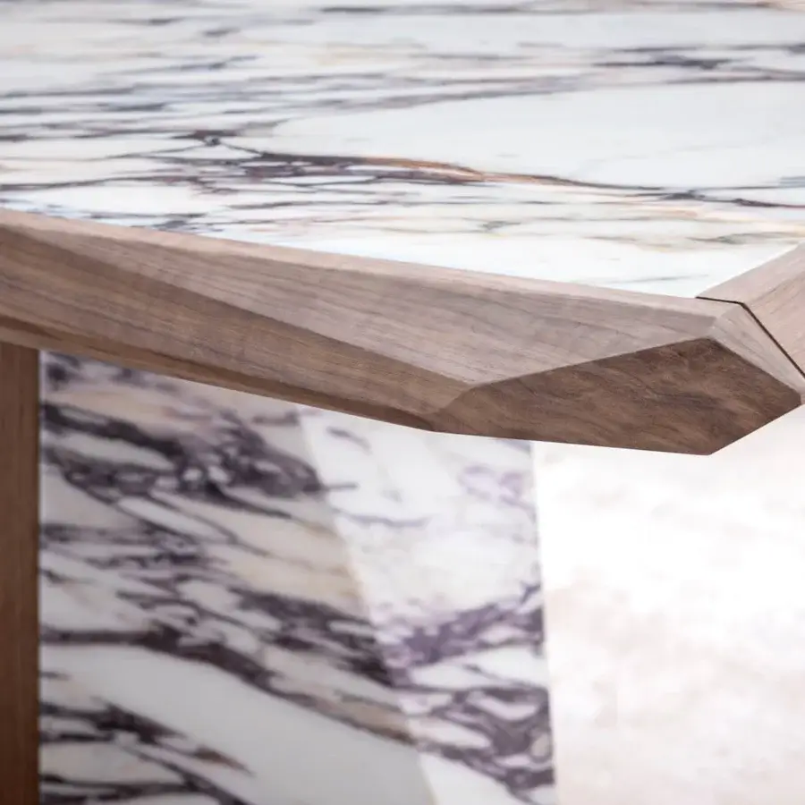 Distinguished Giorgetti Amadeus table crafted with Canaletto walnut and white marble inserts exhibiting purple grey veining with a satin finish