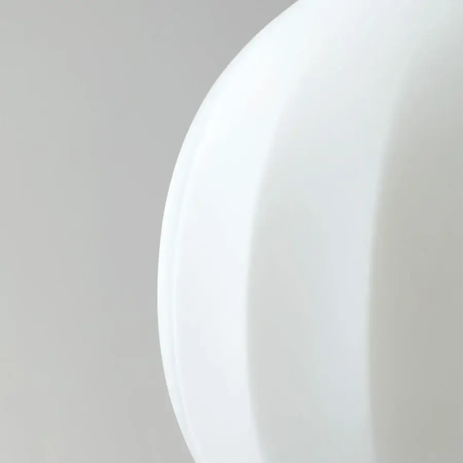 Elegant Luceplan Lita table lamp with rounded form crafted in opaline blown-glass and solid ash wood with uniform white finish