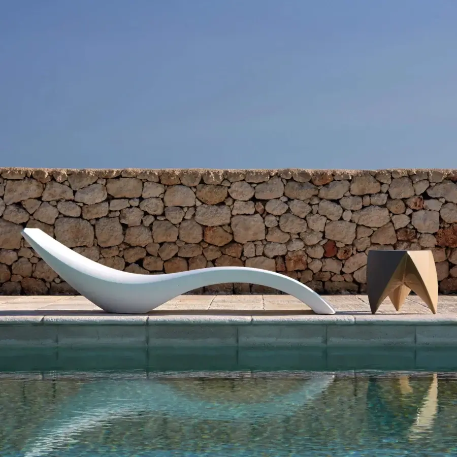 Elegant MY YOUR Cloe lounger with uniquely sculpted form crafted in white Poleasy® material and smooth matte finish