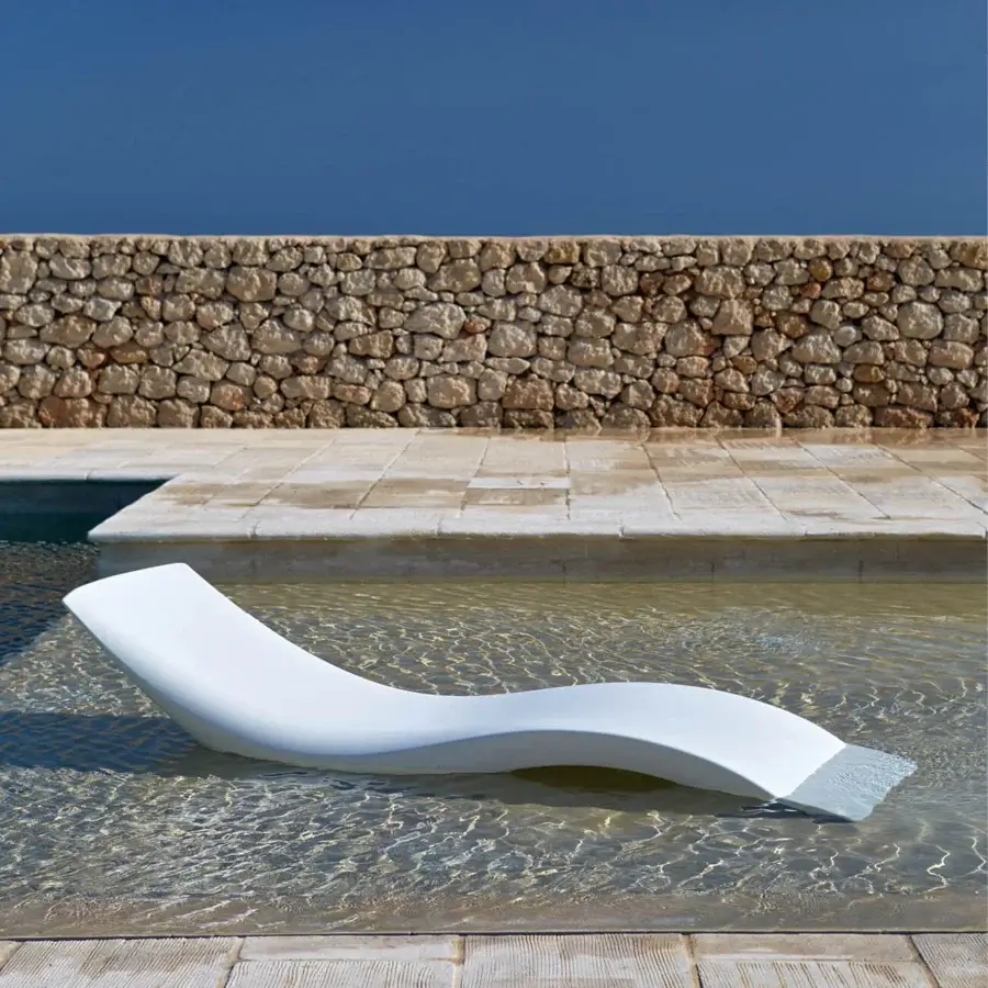 Distinguished MY YOUR Cloe lounger with sculpted form crafted in bright white Poleasy® material and smooth satin finish