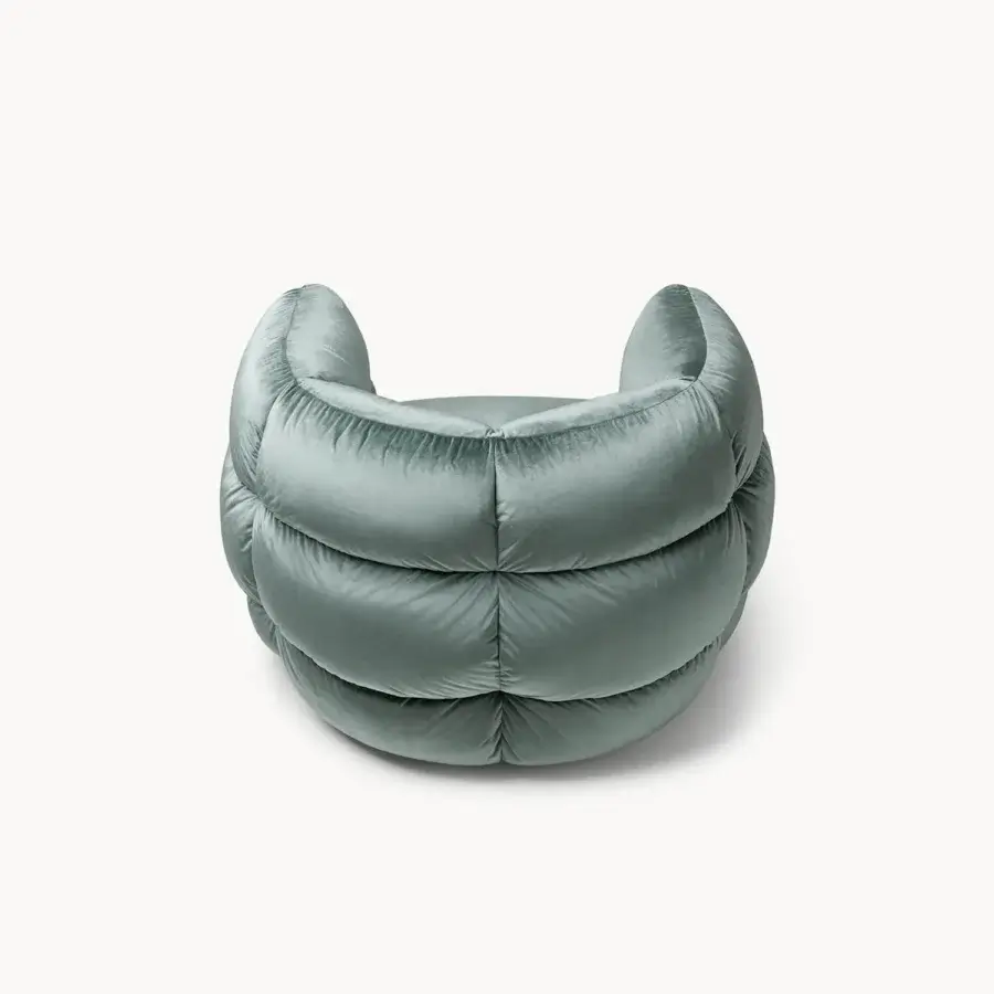 Distinguished Visionnaire Bomber lounge chair with enveloping form upholstered in lavish grayish-green velvet and quilted surface