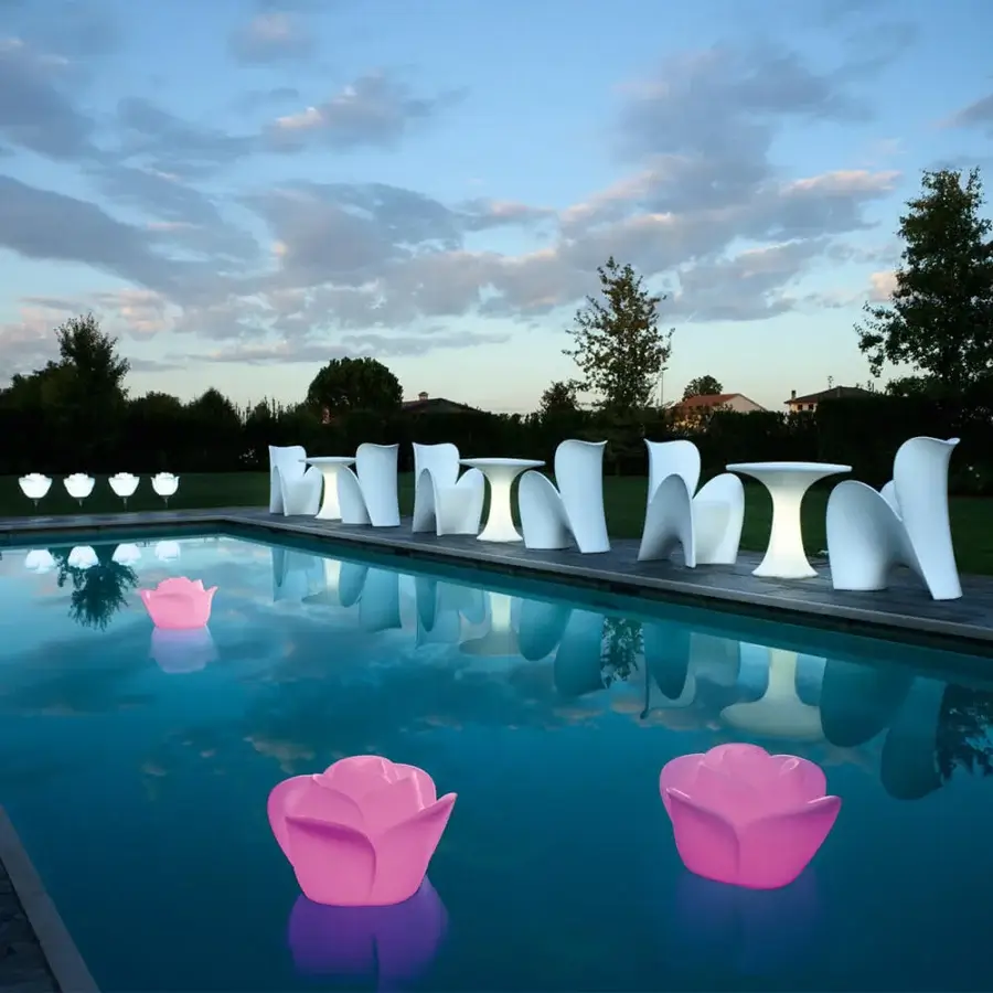 Exceptional MY YOUR Lily chair embodies buoyant design with glossy pink synthetic material crafted for aquatic environments