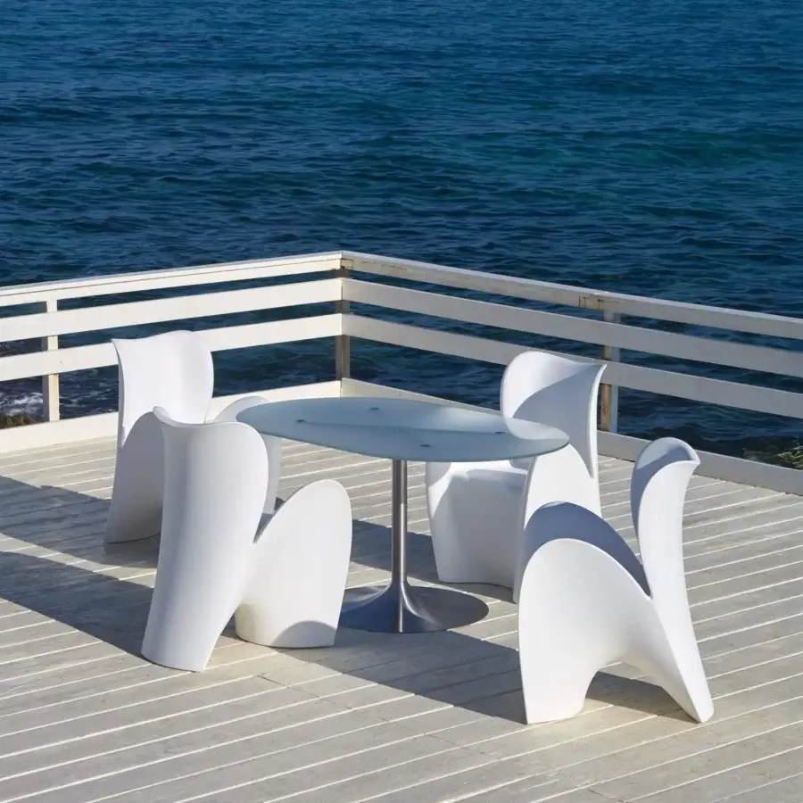 Elegant MY YOUR Lily chair embodies uniquely sculpted form with glossy white plastic construction crafted in Italy