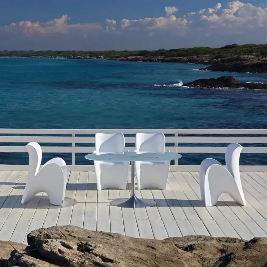 Superior MY YOUR Lily chair embodies a fresh contemporary aesthetic with sculpted petal form and glossy white synthetic material